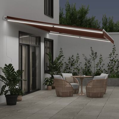 vidaXL Ročno zložljiva tenda z LED rjava 600x350 cm