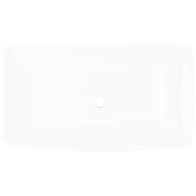 Pravokotni umivalnik bele barve dimenzije 71 x 39 cm